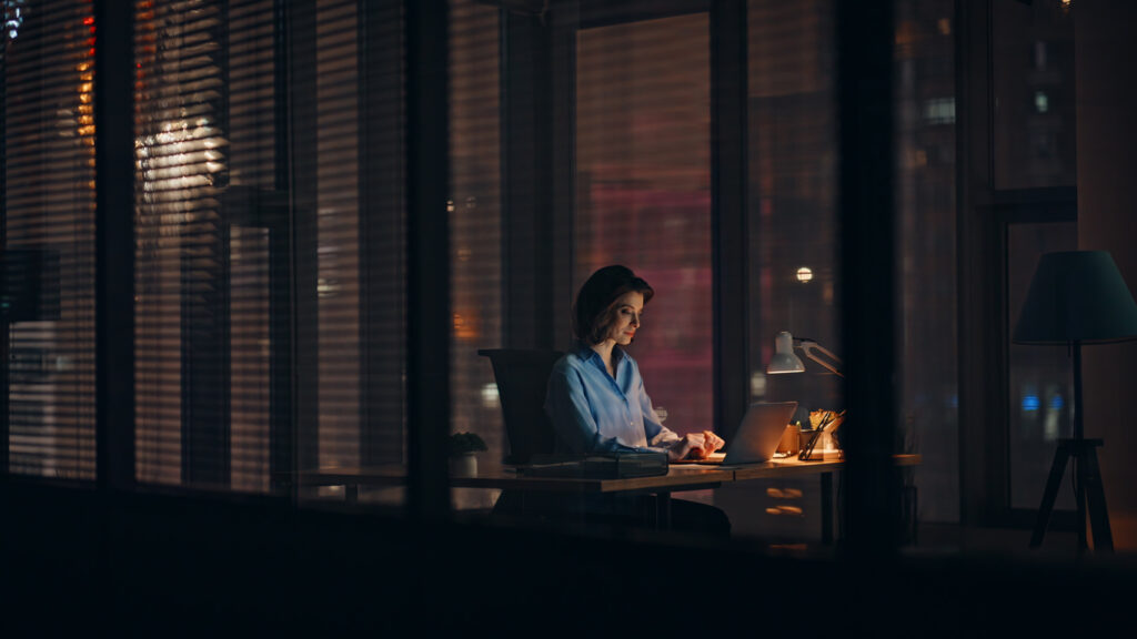 Employee checking on her Valet Finance premium financing on her laptop as its fully integrated into your insurance software
